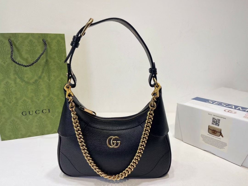 G*u*i top handle bags